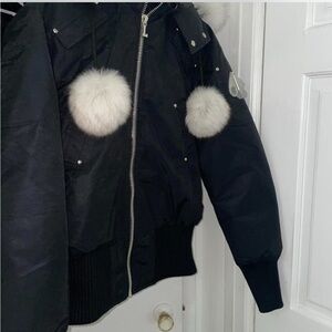 Moose Knuckles Black Puffer Jacket with White Fur Accents